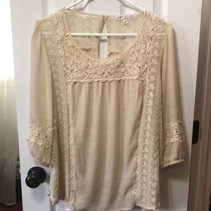 Sheer lace blouse with 3/4 length sleeves.